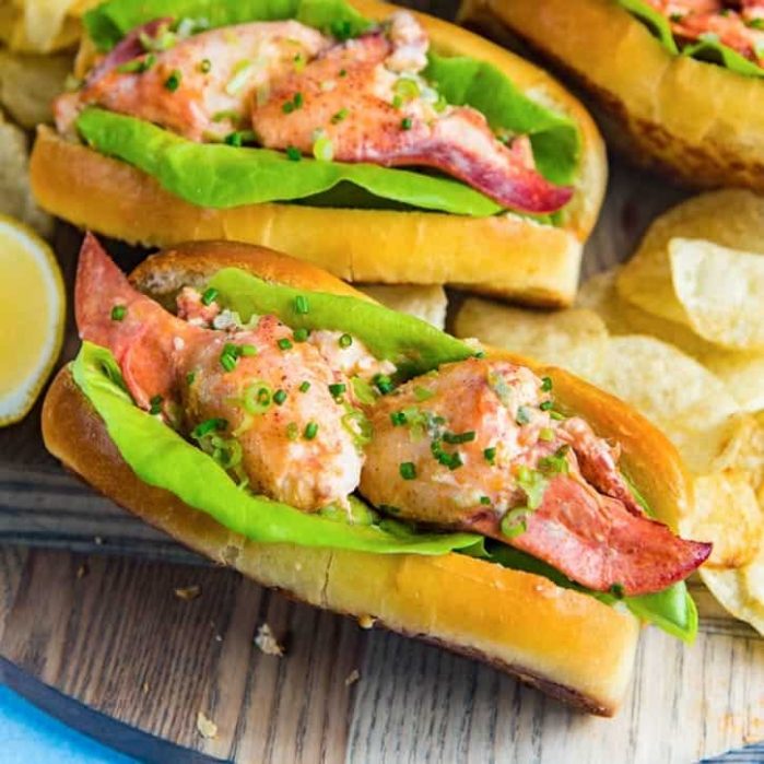 All you need to know about making and serving the ULTIMATE Maine Lobster Rolls in one post. A flavorful Lobster salad roll made with buttery lobster and homemade lobster roll buns.
