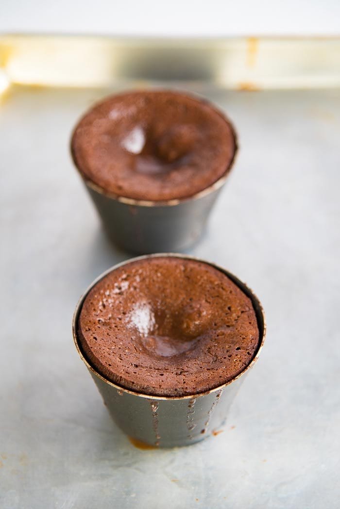 Freshly baked chocolate molten lava cakes for two people.
