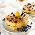 Fluffiest Blueberry Pancakes - Delicious blueberry pancakes to start the day with juicy and sweet blueberries. Make them with a pancake mix or from scratch, but either way will be fluffy and amazing. 