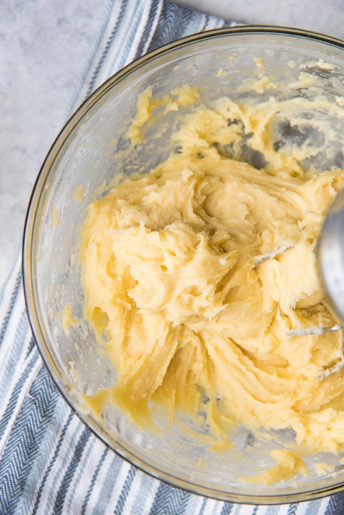 Step by step classic eclair recipe - the choux pastry dough is still dry, so keep adding more.