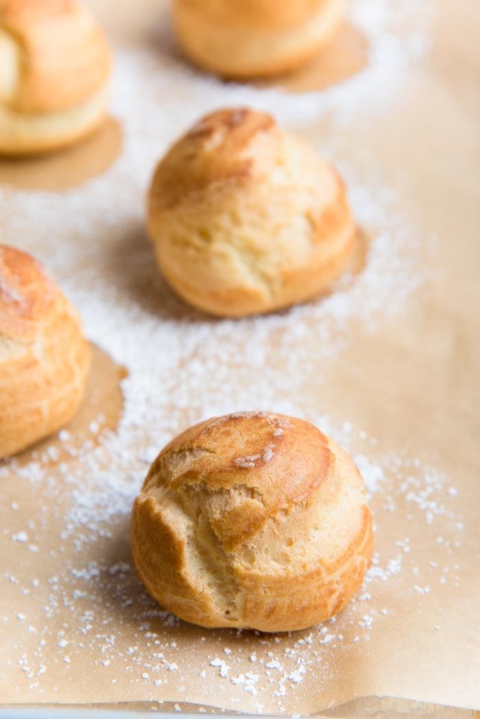 Learn how to make Perfect Choux Pastry (Or Pâte à Choux!) - The only recipe guide you will ever need to make choux pastry, with perfect results every time. Plus a troubleshooting guide for your choux pastry recipe.  Fool proof choux pastry to make profiteroles, eclairs, cream puffs and more. 