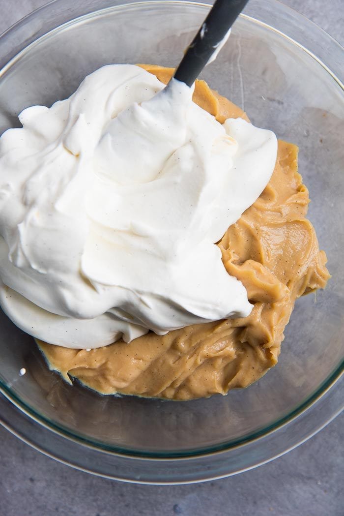 Salted caramel pastry cream in a bowl, with stabilized whipped cream before being mixed together