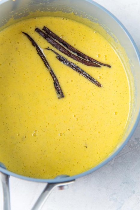 The egg yolks, sugar and vanilla beans whisked together to make a thick paste.