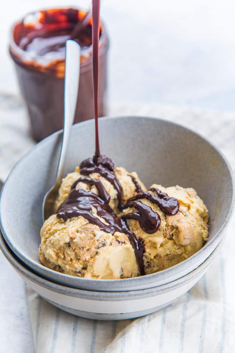 Salted butterscotch ice cream with cookie dough served with hot fudge sauce drizzled on top