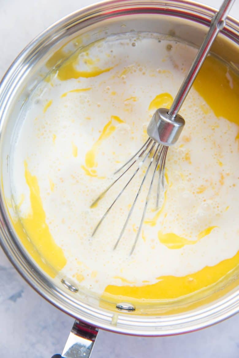 Whisking in the dairy, into the lemon ice cream base for the lemon ice cream recipe