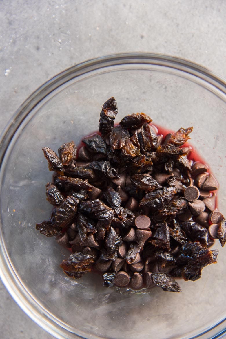 Place the chocolate, prunes, and liquid in a bowl to heat