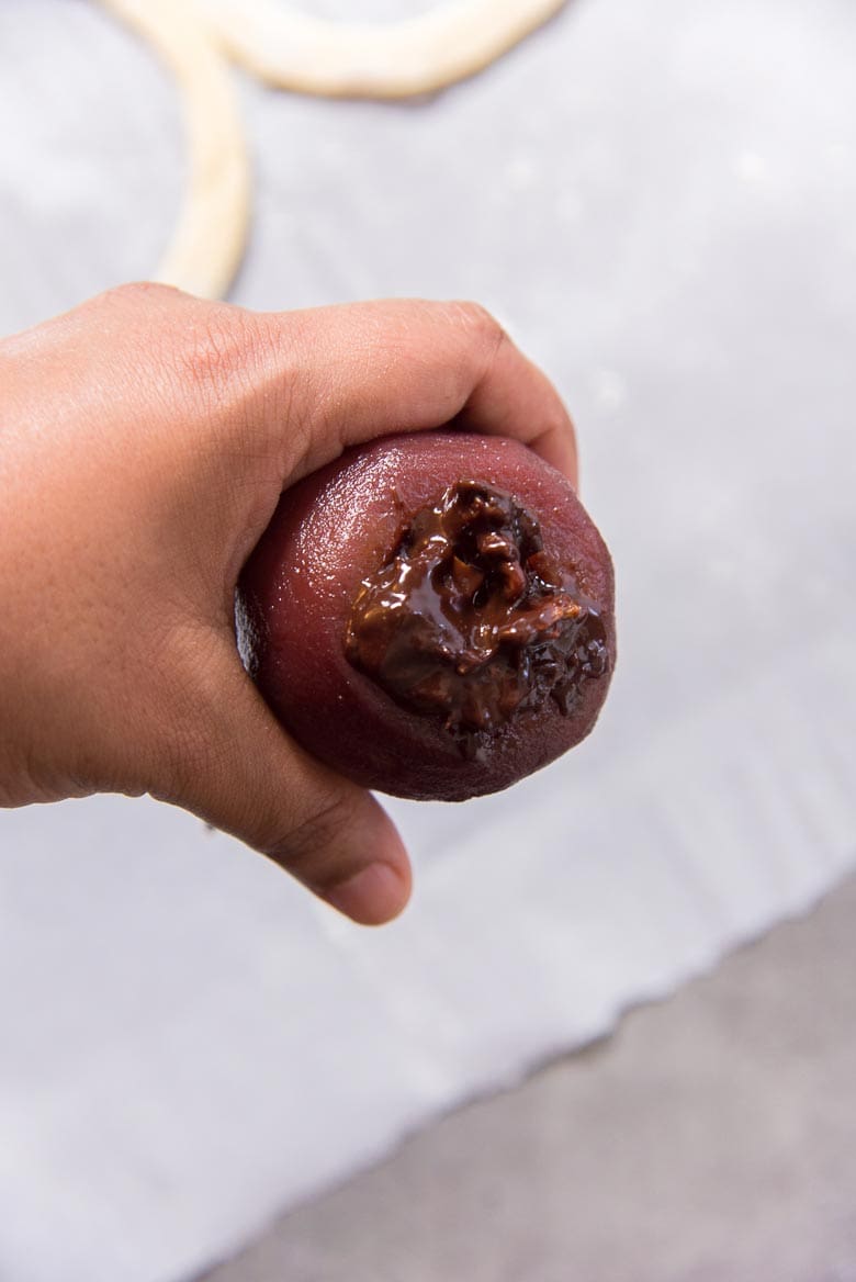 Stuffing the poached pear with the chocolate mix