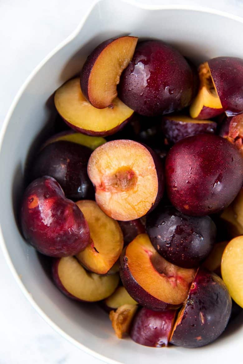 Cut plums without the seeds in a bowl