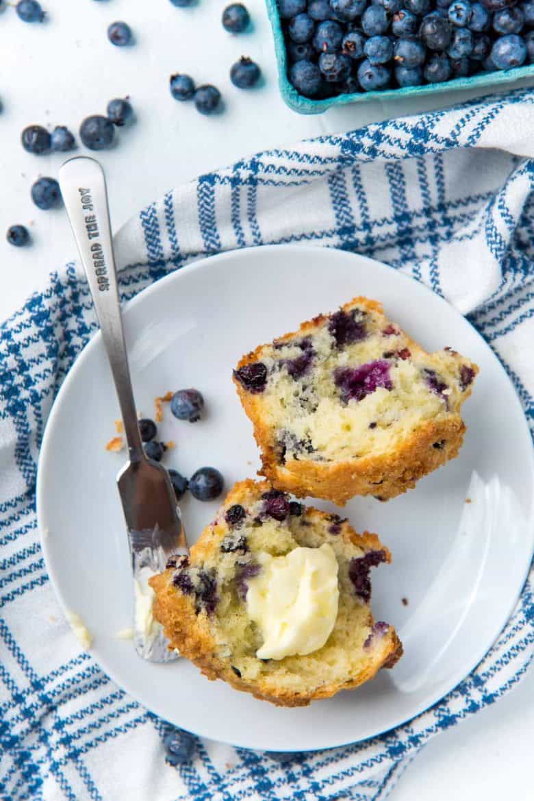 Split blueberry muffin with butter
