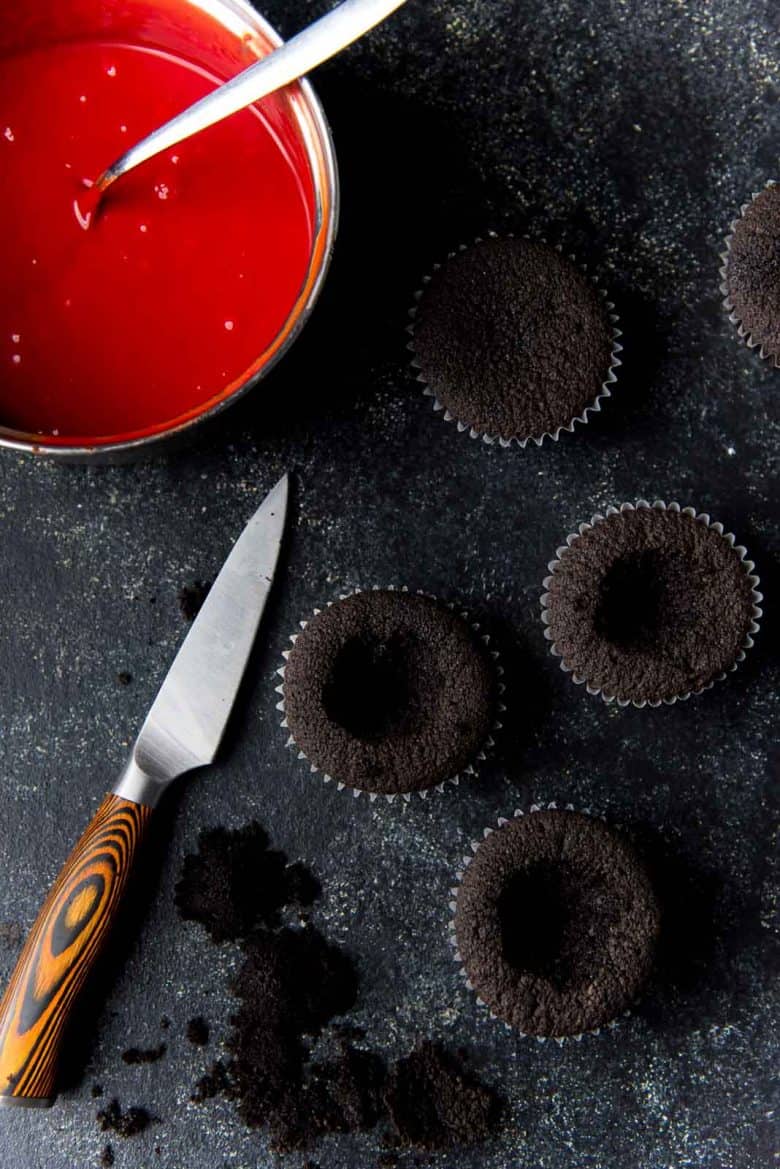 Hollowing out cupcakes to fill with white chocolate ganache