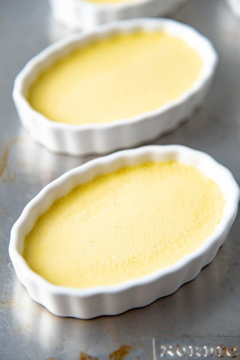 Baked and cooled creme brulee in oval creme brulee dishes