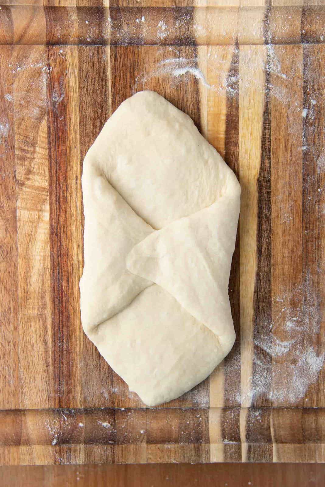 Shaping milk bread loaf - fold in the opposite edges to the middle