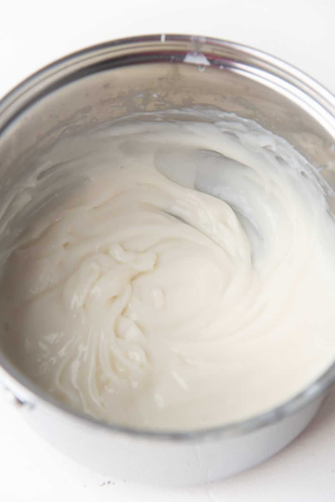 Heating the mixture to form a paste