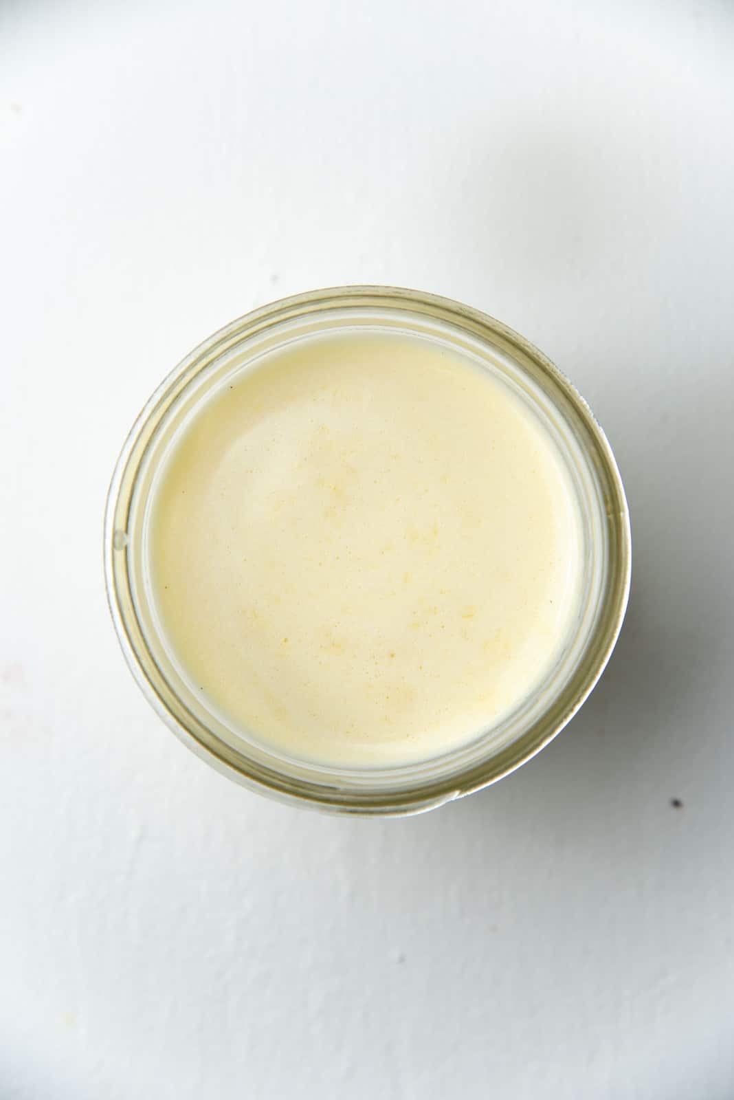 No bubbles on the custard surface anymore after using a blow torch to lightly flame the surface.
