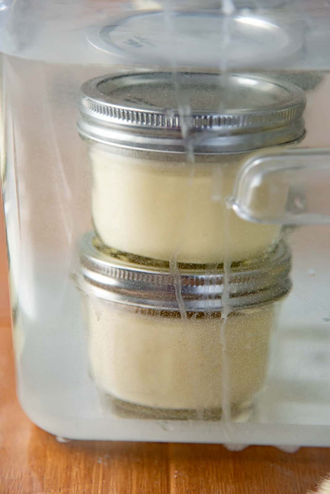 Sous vide creme brulee cooking inside the sous vide circulator container