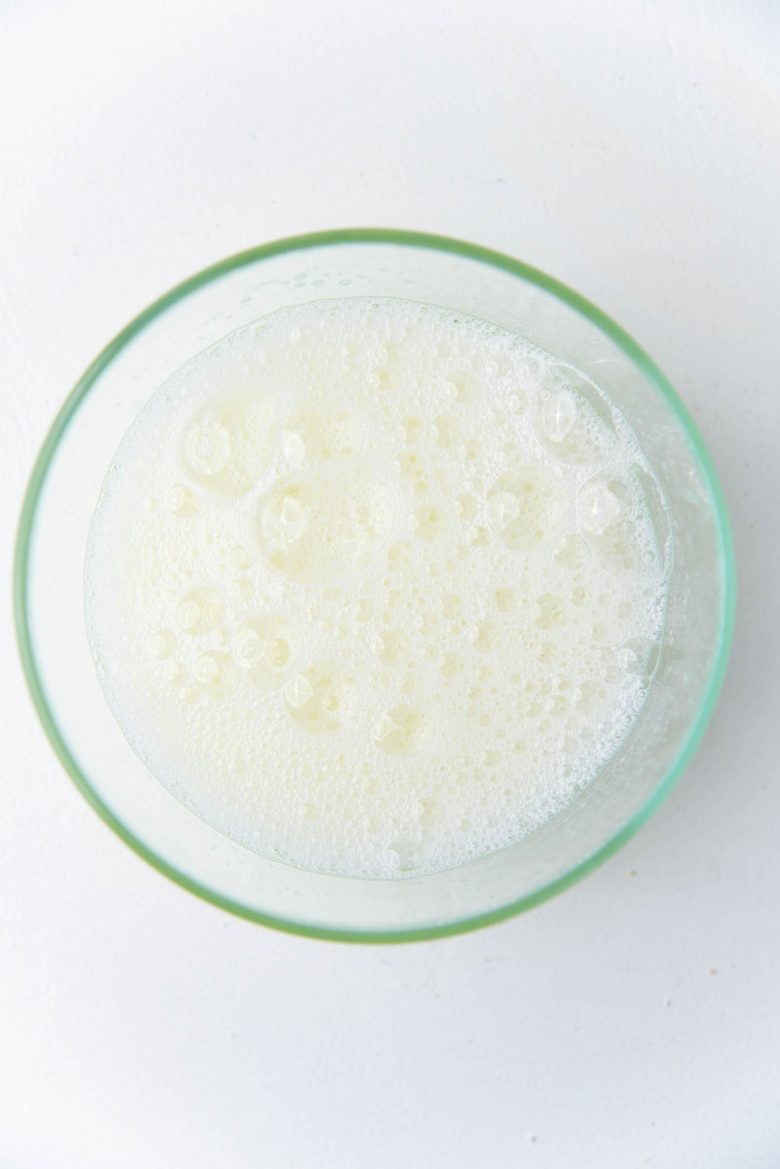 Whisked frothy egg whites in a bowl
