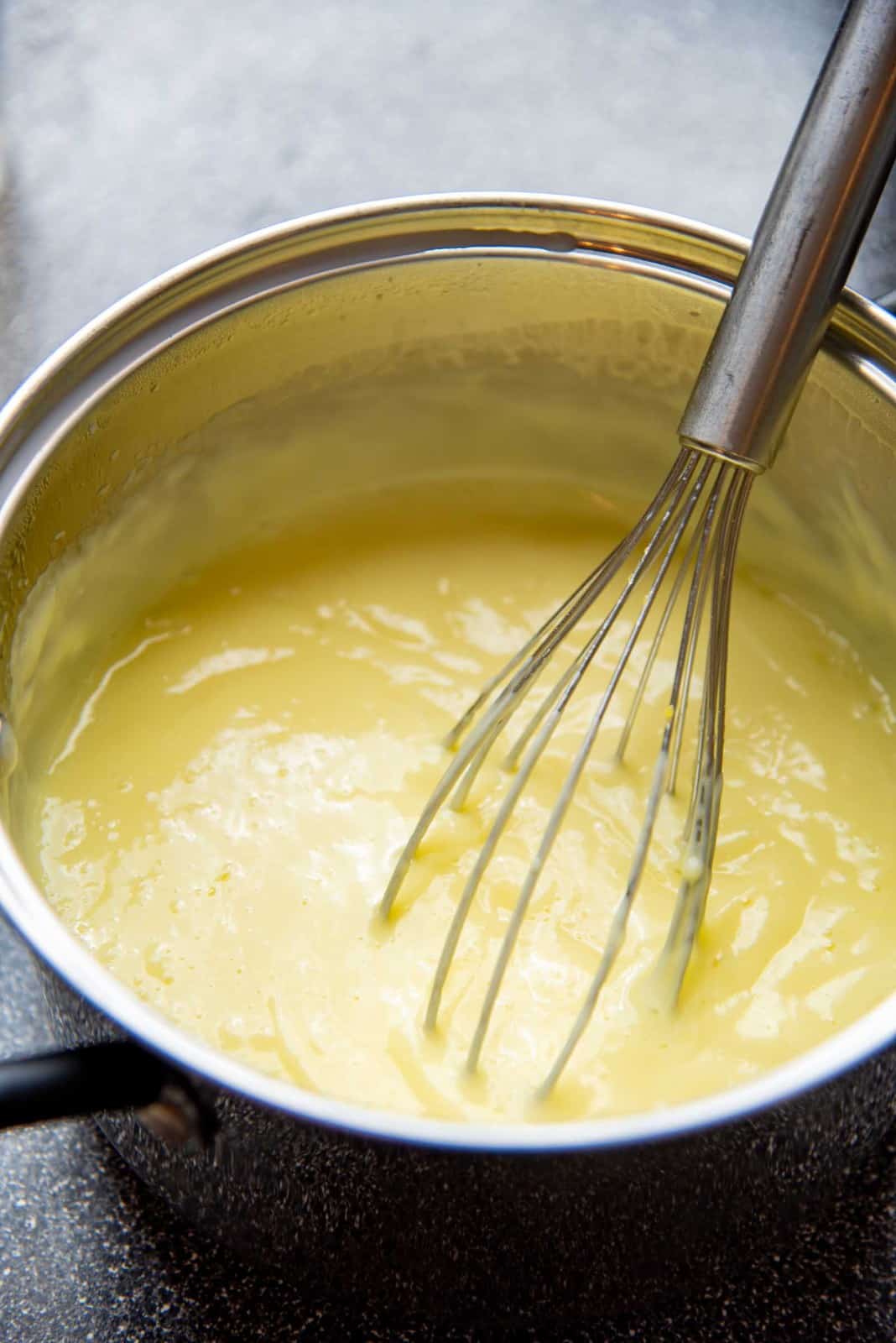 Cooking vanilla pudding until thickened