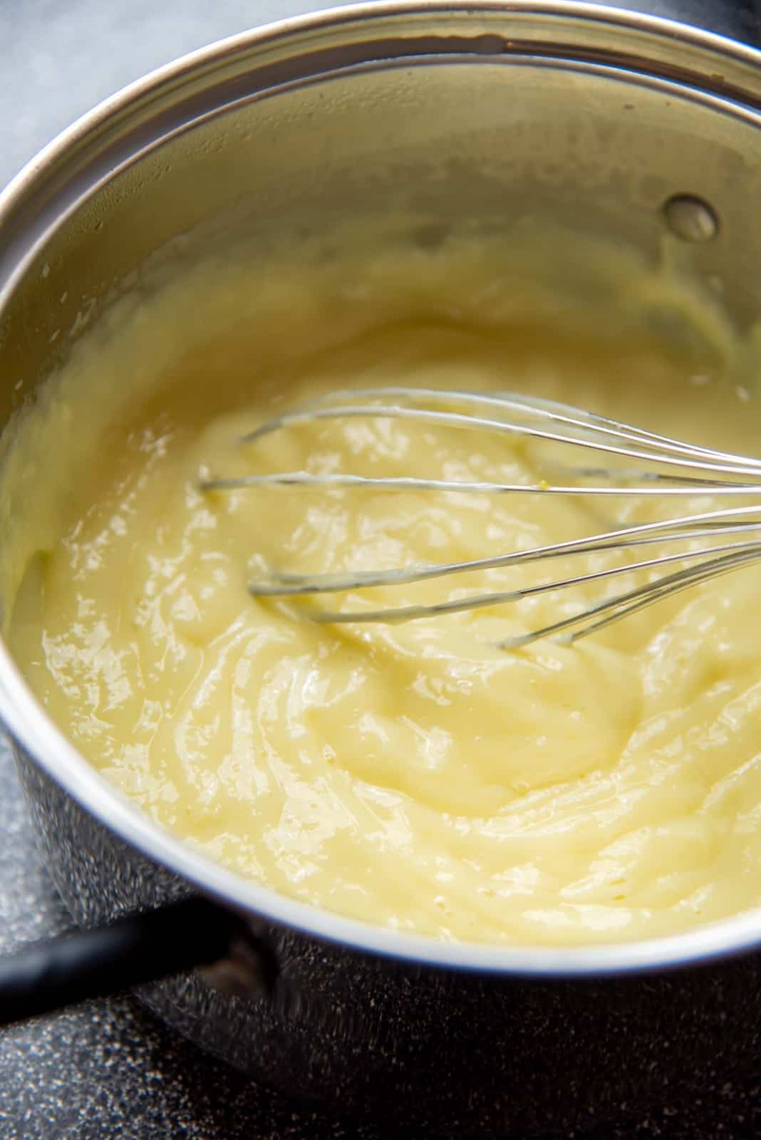 Thickened vanilla pudding in a saucepan
