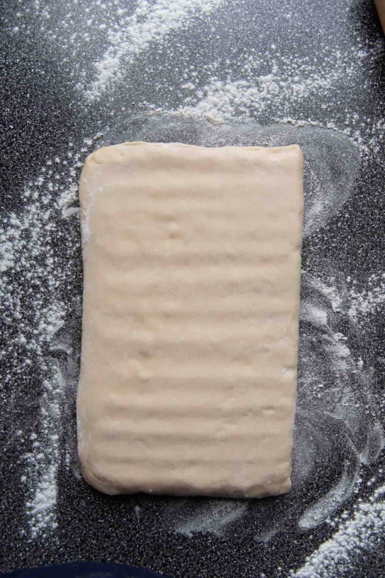 A view of what the dough looks like after tapping the dough with the rolling pin.