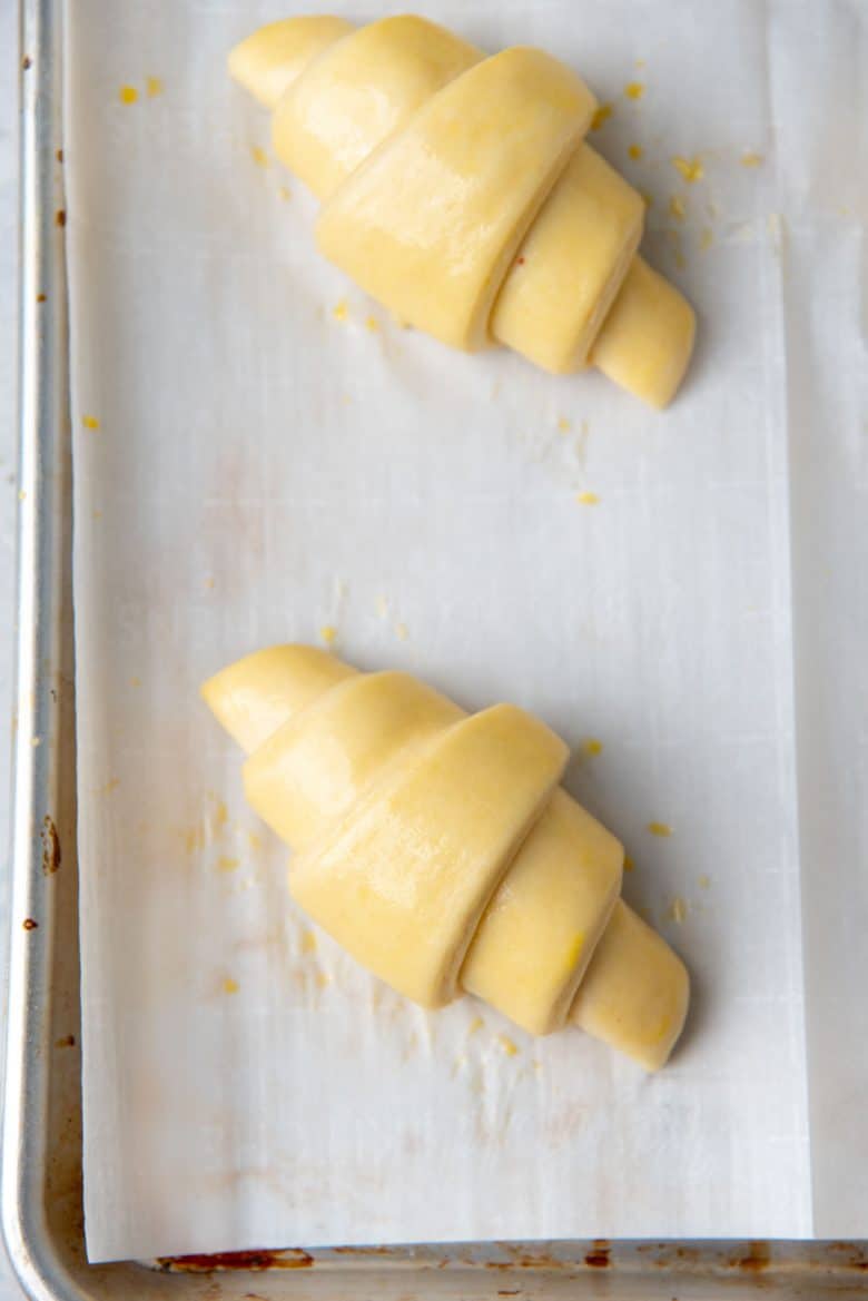 An overhead view of the proofed croissants before being baked