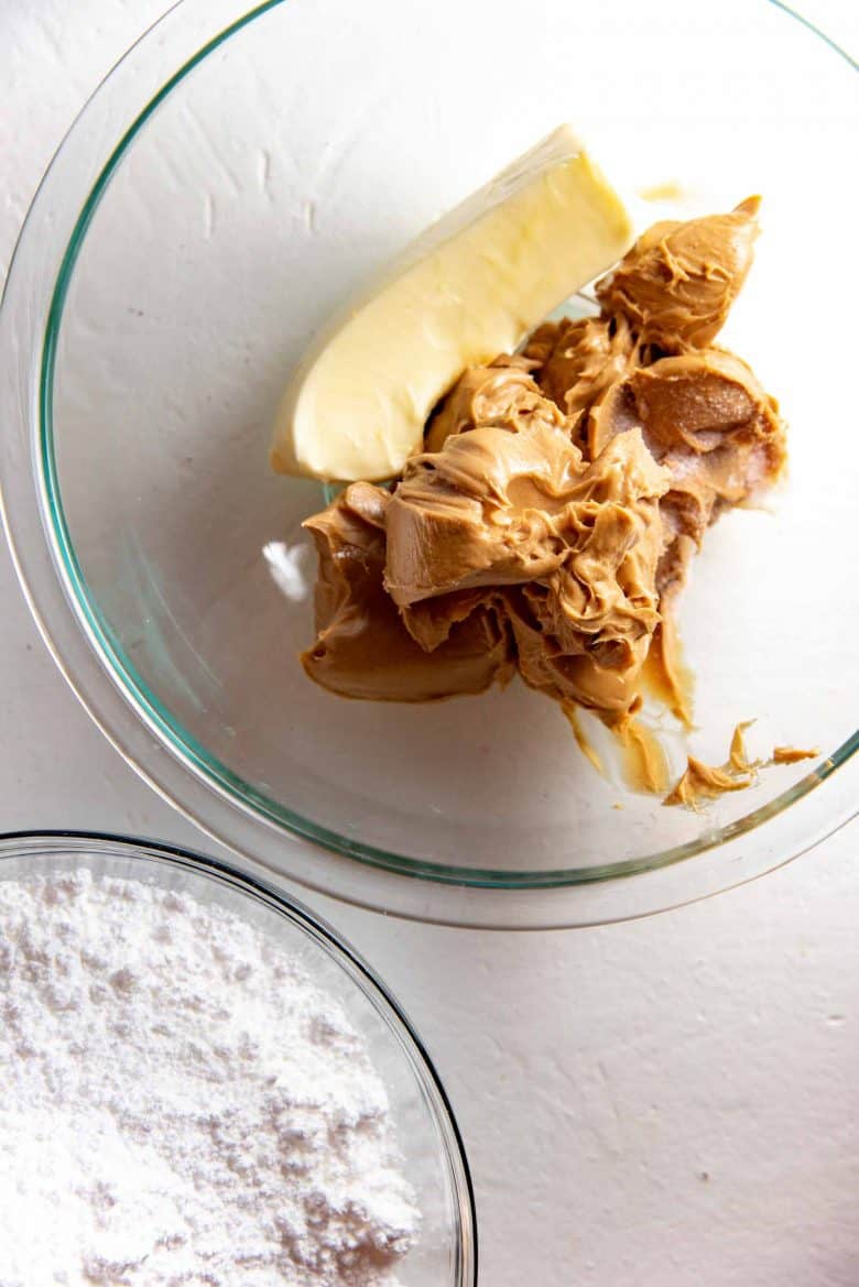 Butter and peanut butter in one large bowl, and confectioner's sugar in a another bowl before mixing together.