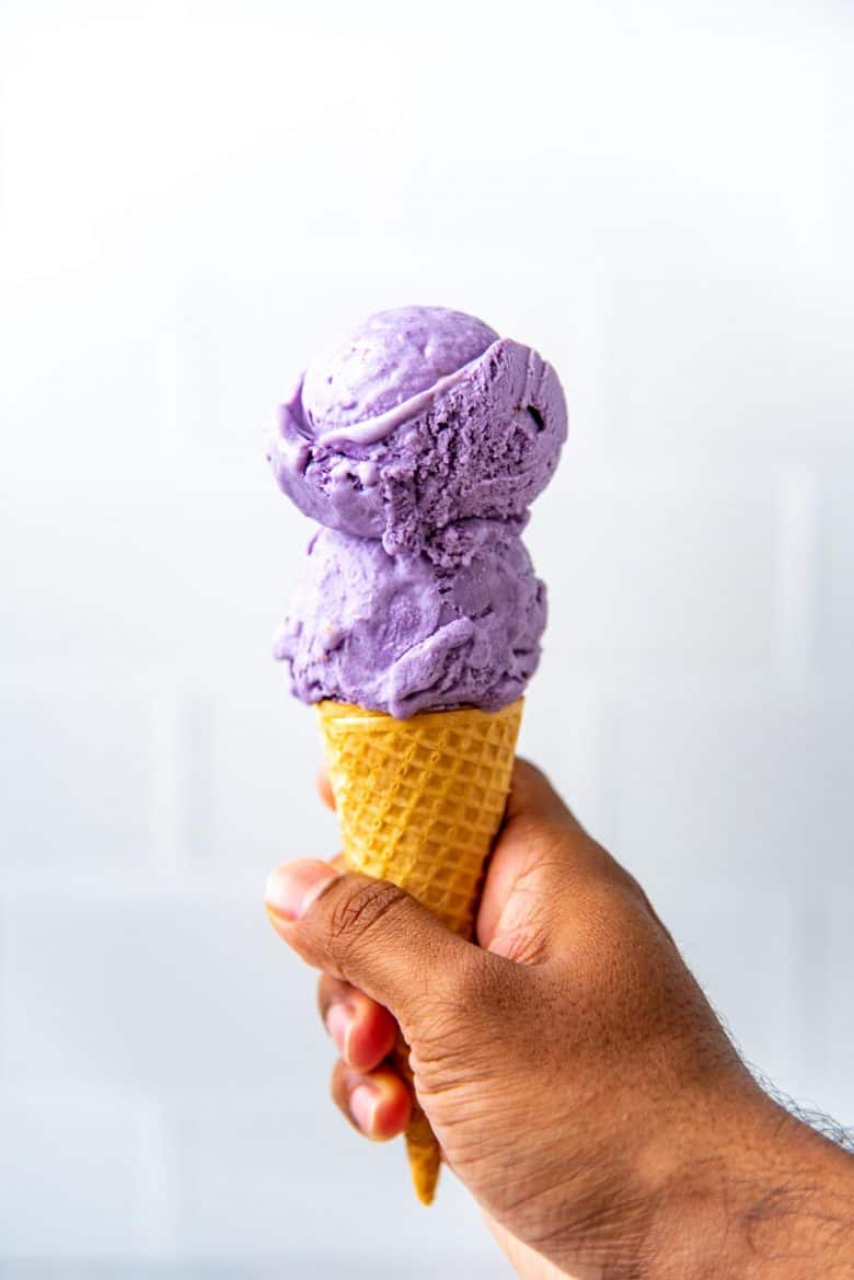 Creamy ube ice cream served in an ice cream cone