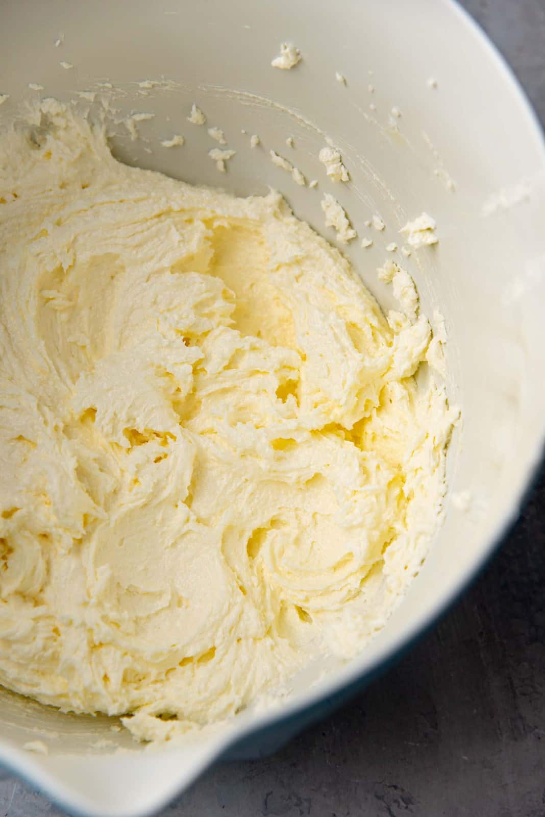 Creamier, fluffier butter and sugar mixture after mixing for a few minutes