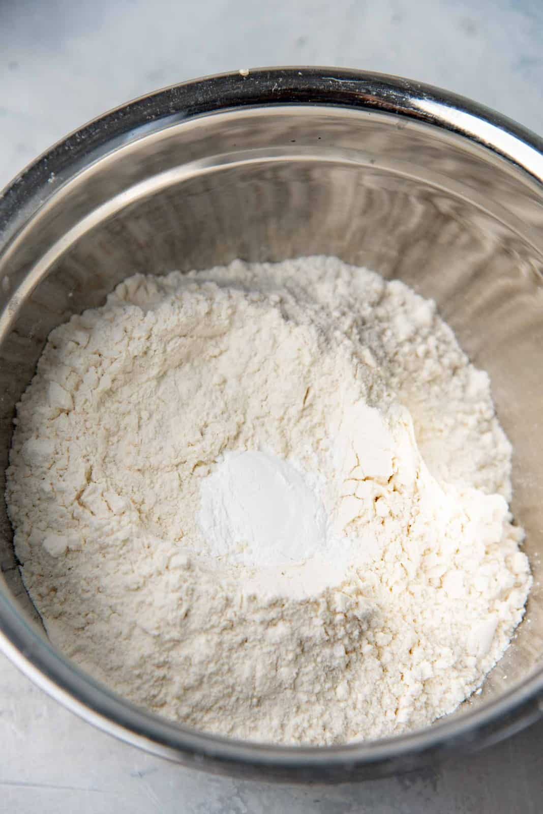 Dry ingredients - flour and baking powder in a bowl