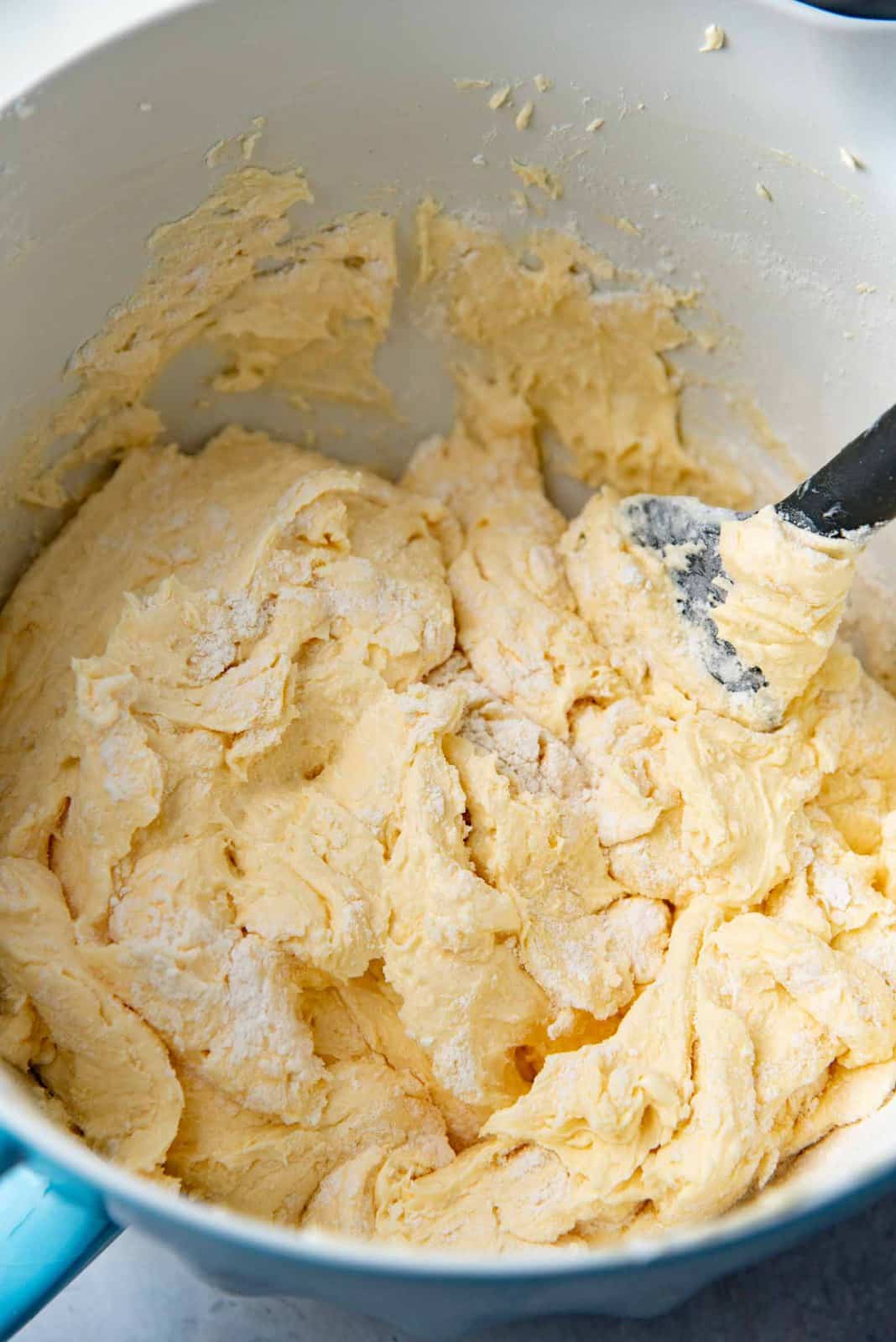 An image to show mid way through the folding process of the flour into the cake batter