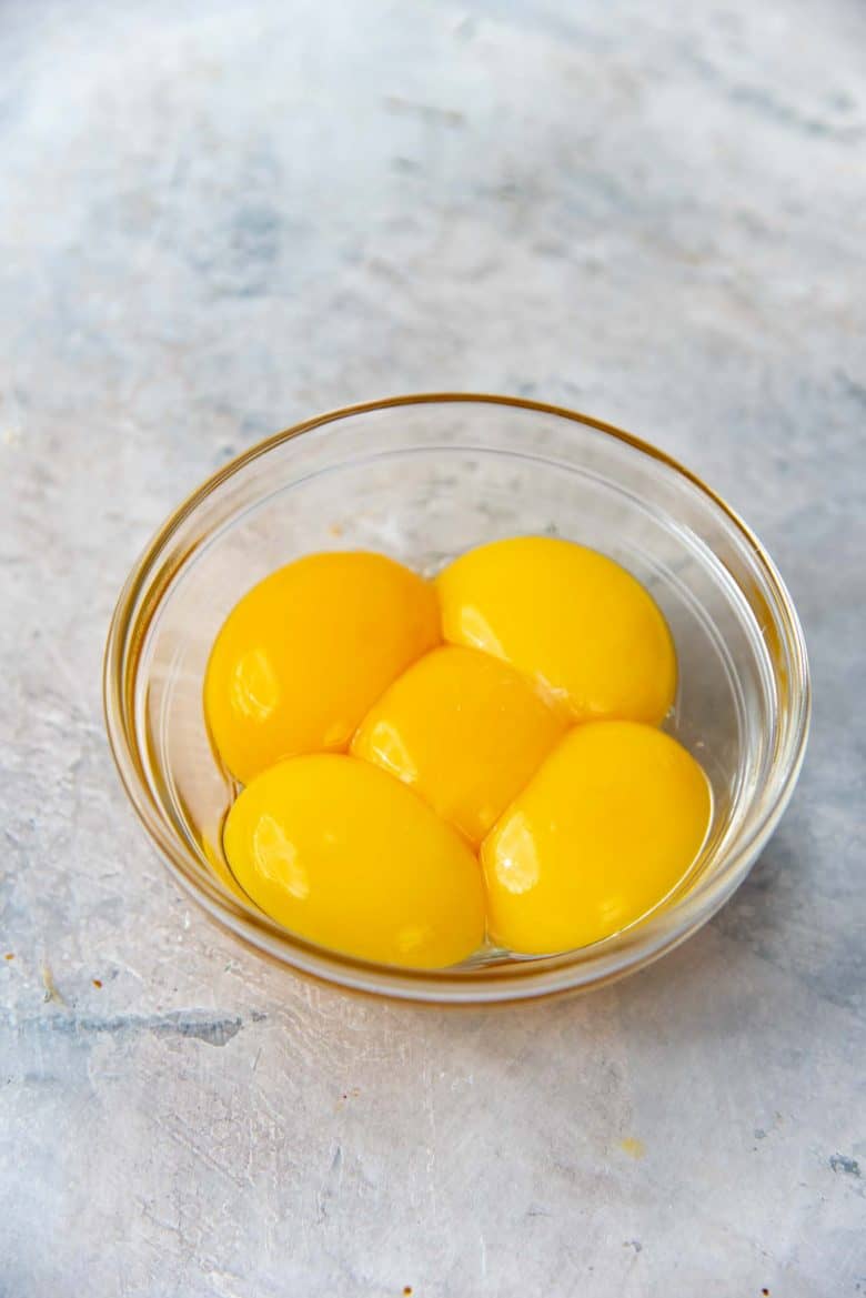 5 egg yolks in a small bowl