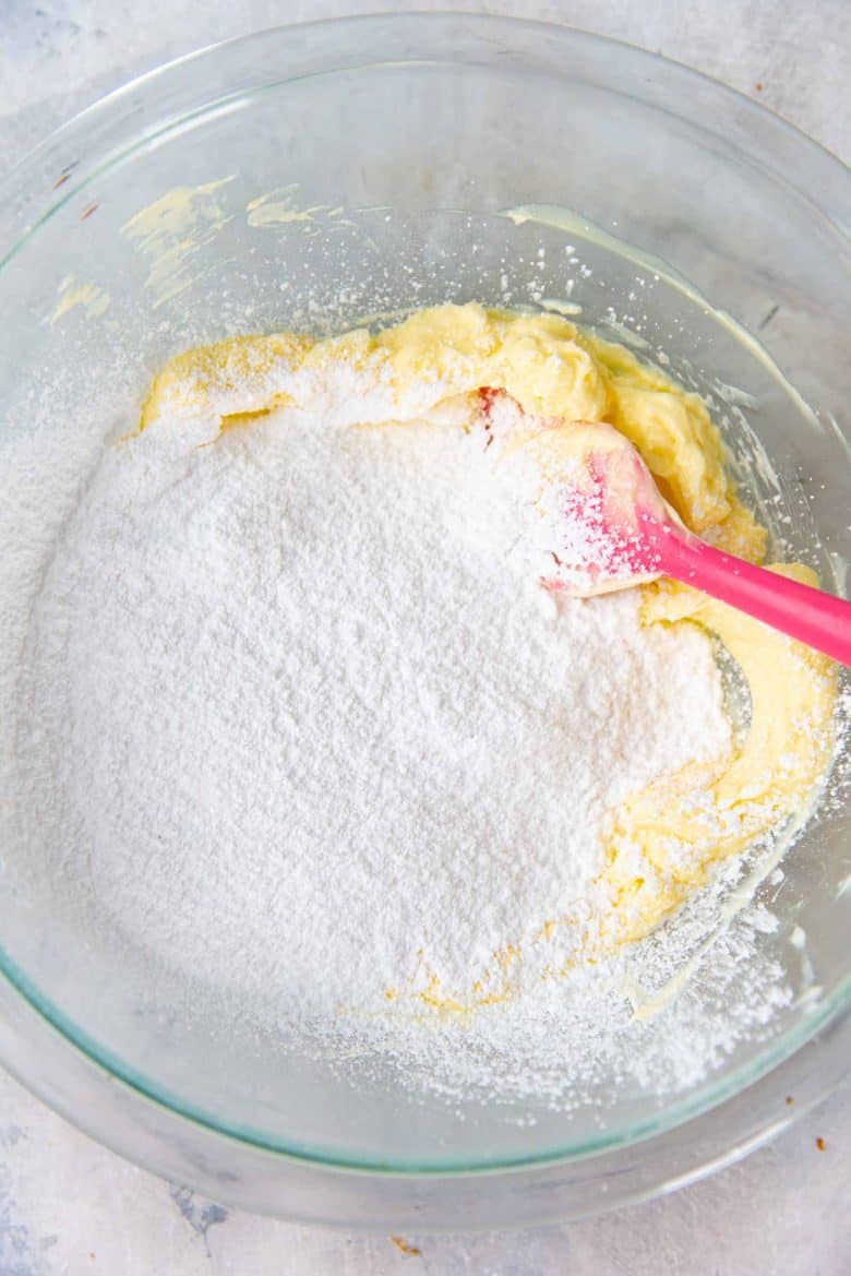 Adding confectioners sugar to the butter