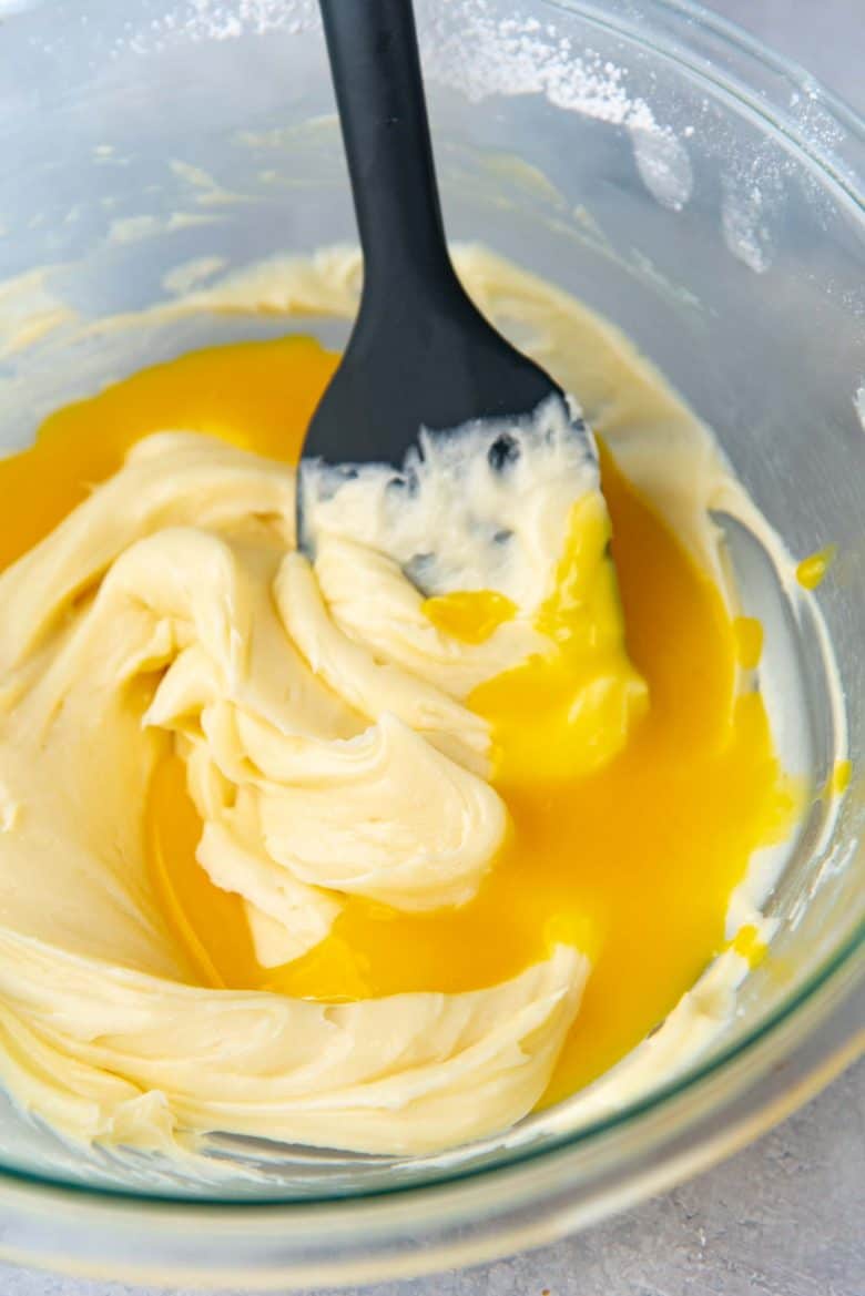 Egg yolks mixture added to the butter sugar ixture