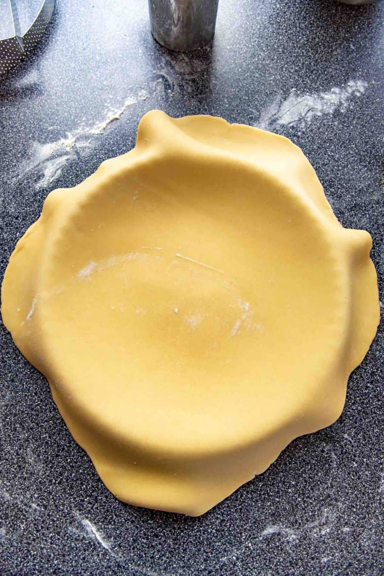 Placing the pastry dough inside the tart mold