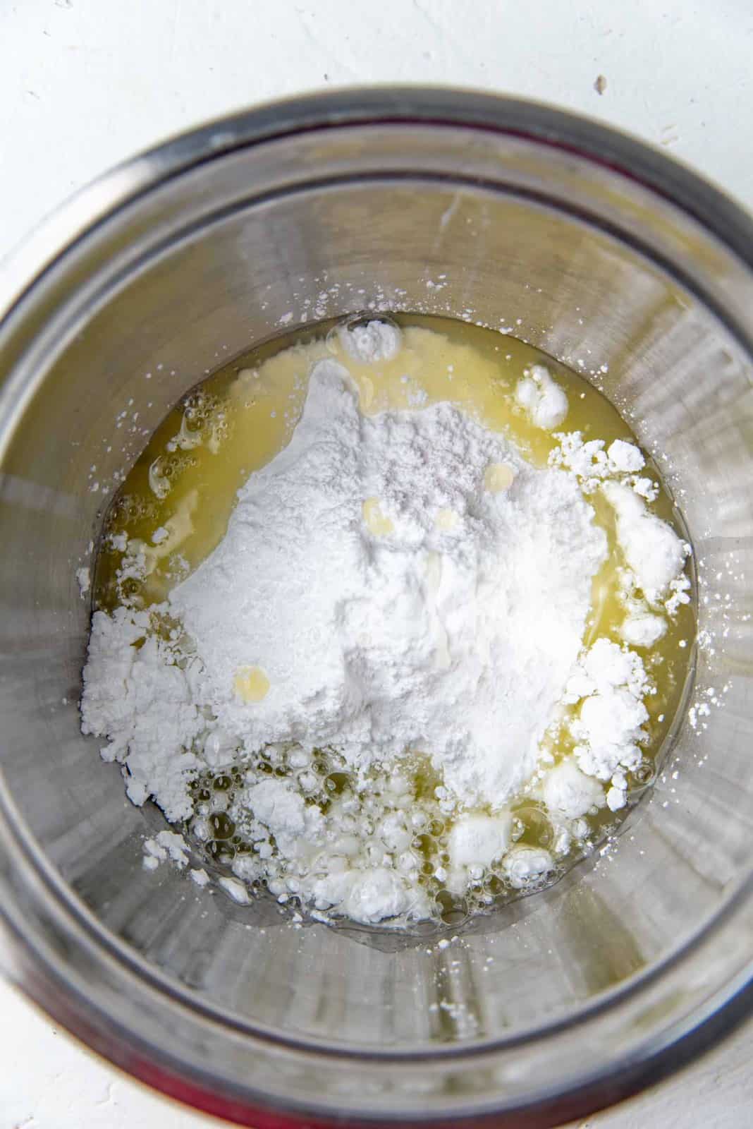 Pasteurized egg white and confectioners sugar in a bowl