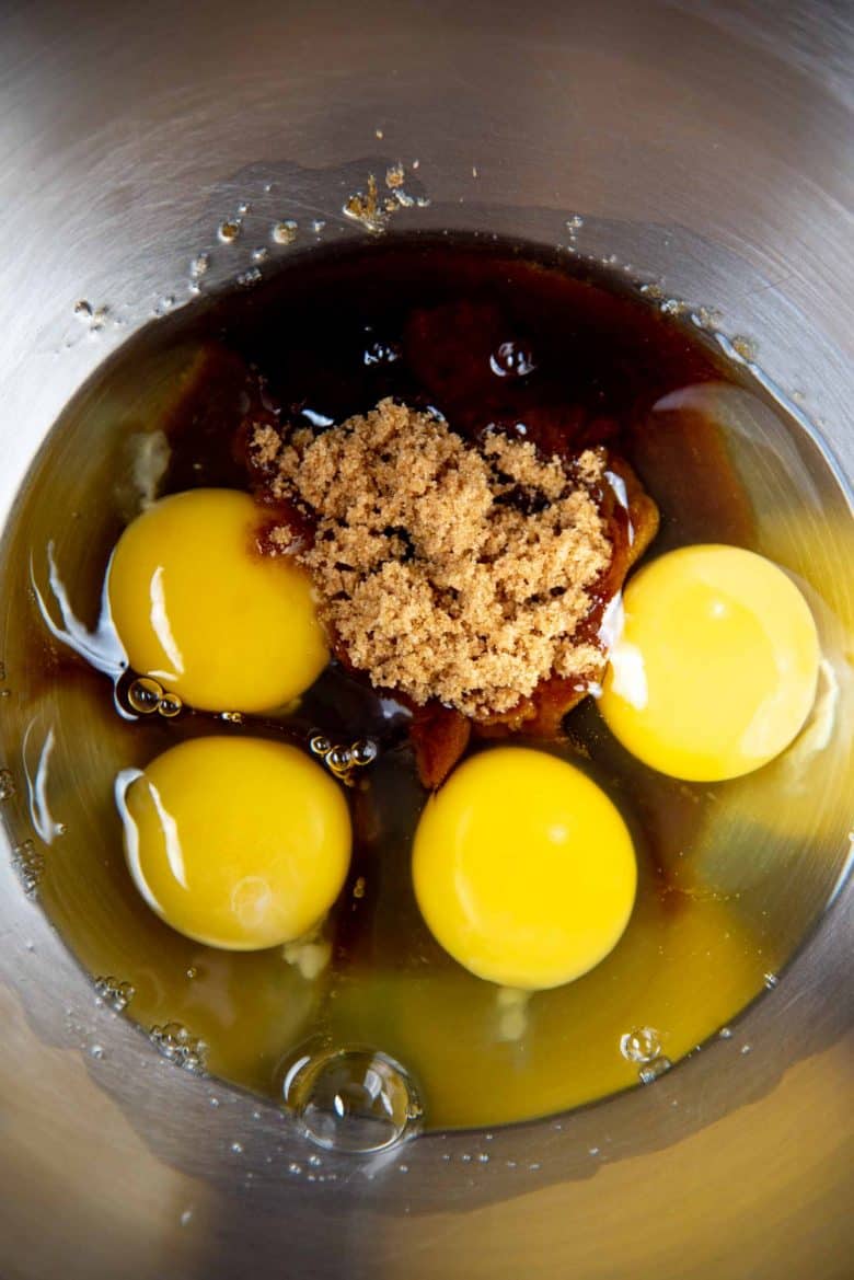 Eggs and brown sugar in a large mixing bowl
