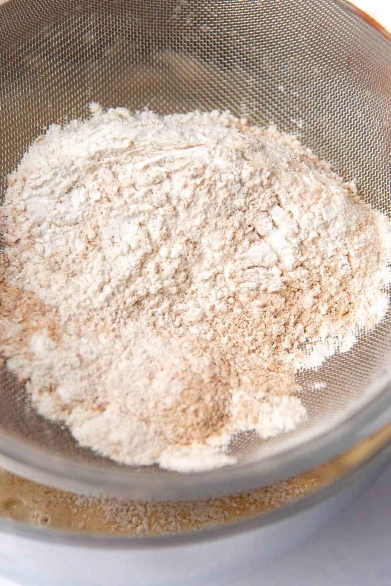 Dry ingredients in a sieve over the mixing bowl