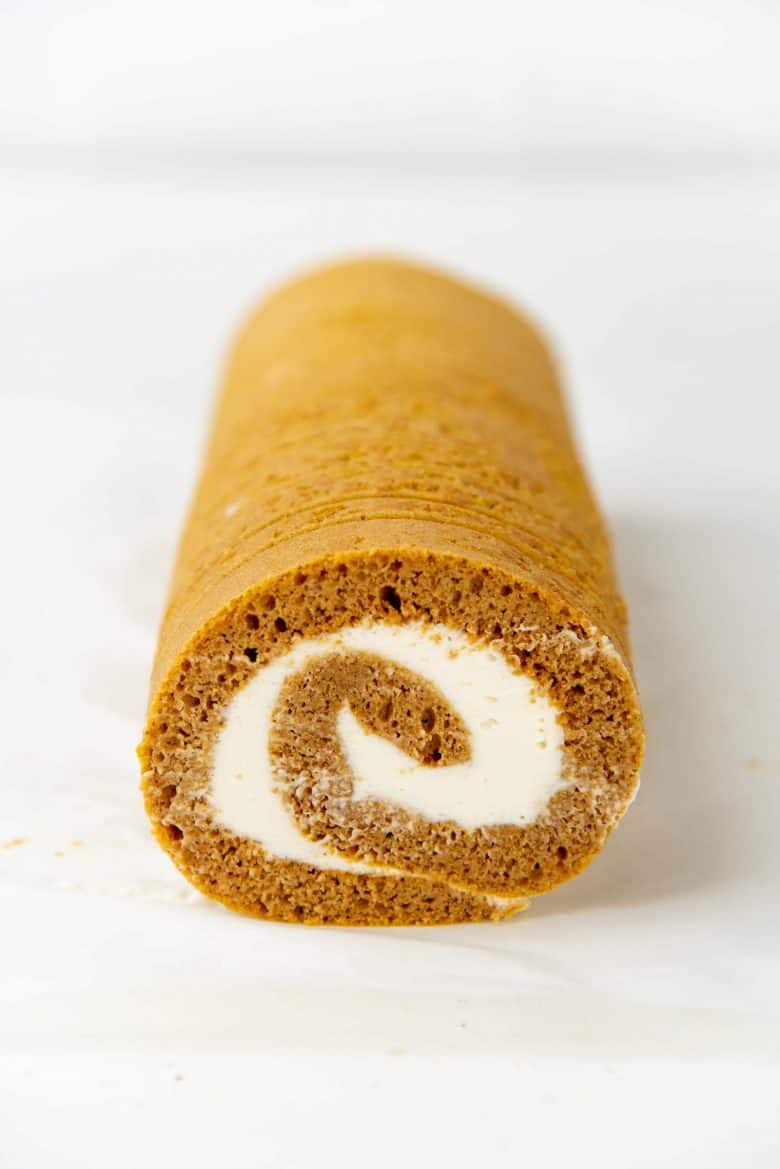 Pumpkin swiss roll cake after the edges have been trimmed