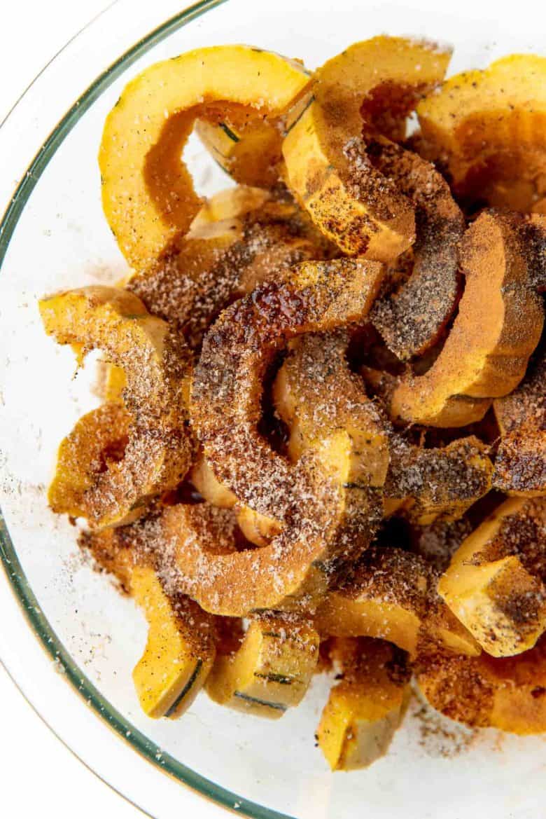 Salt, pepper and cinnamon added to the delicata squash