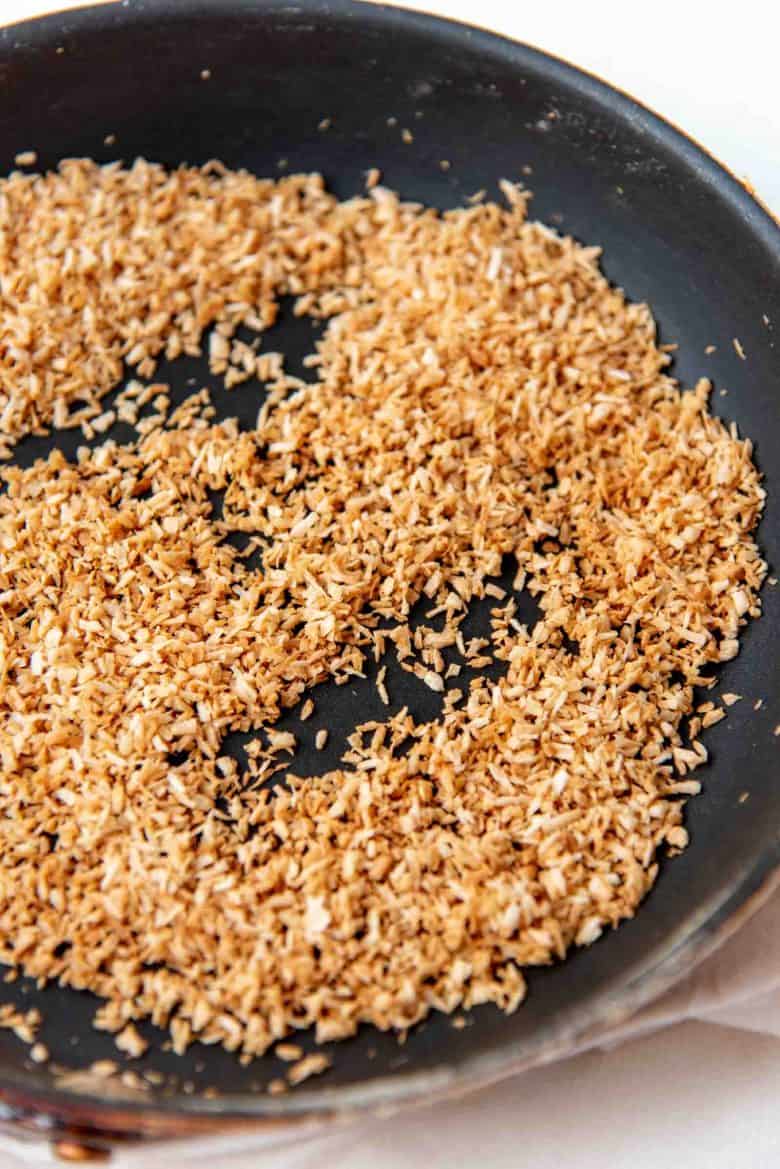 Toasted desiccated coconut in a non stick pan