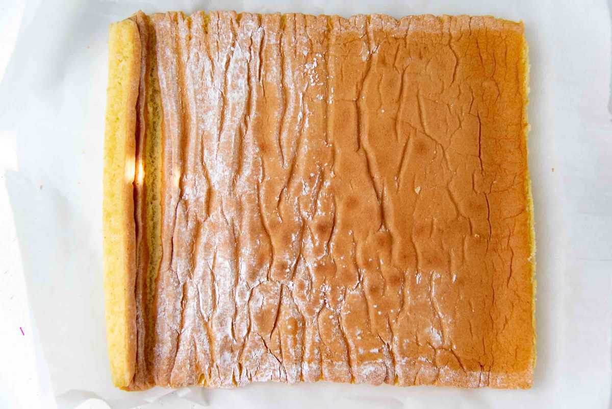 Unravelling the cooled swiss roll cake sheet