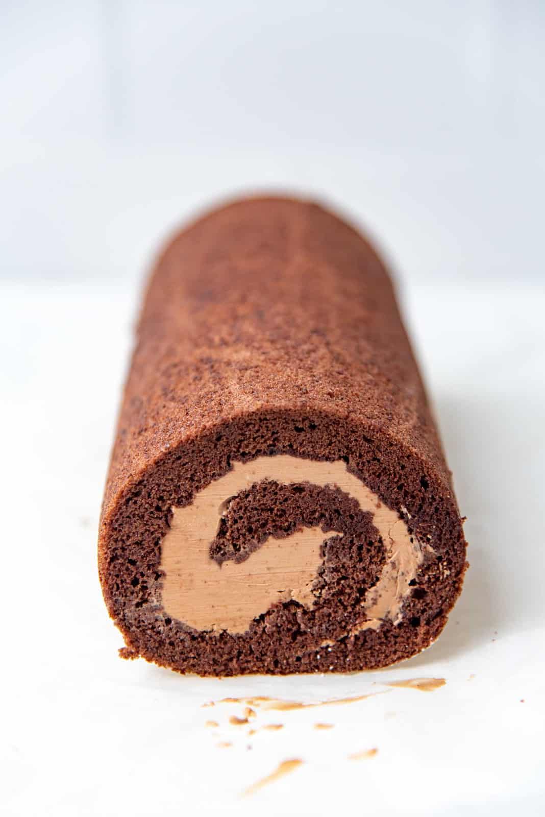 A rolled chocolate swiss roll after edges trimmed
