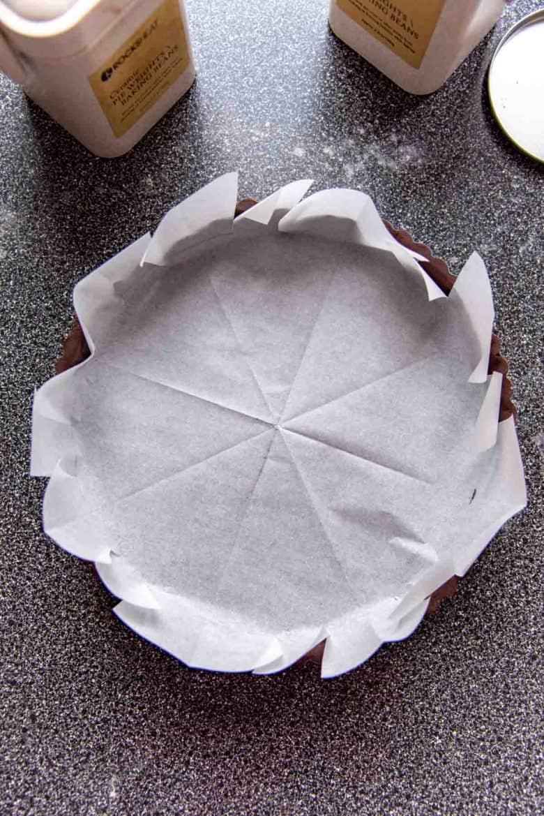 Lining the tart shell with a parchment paper
