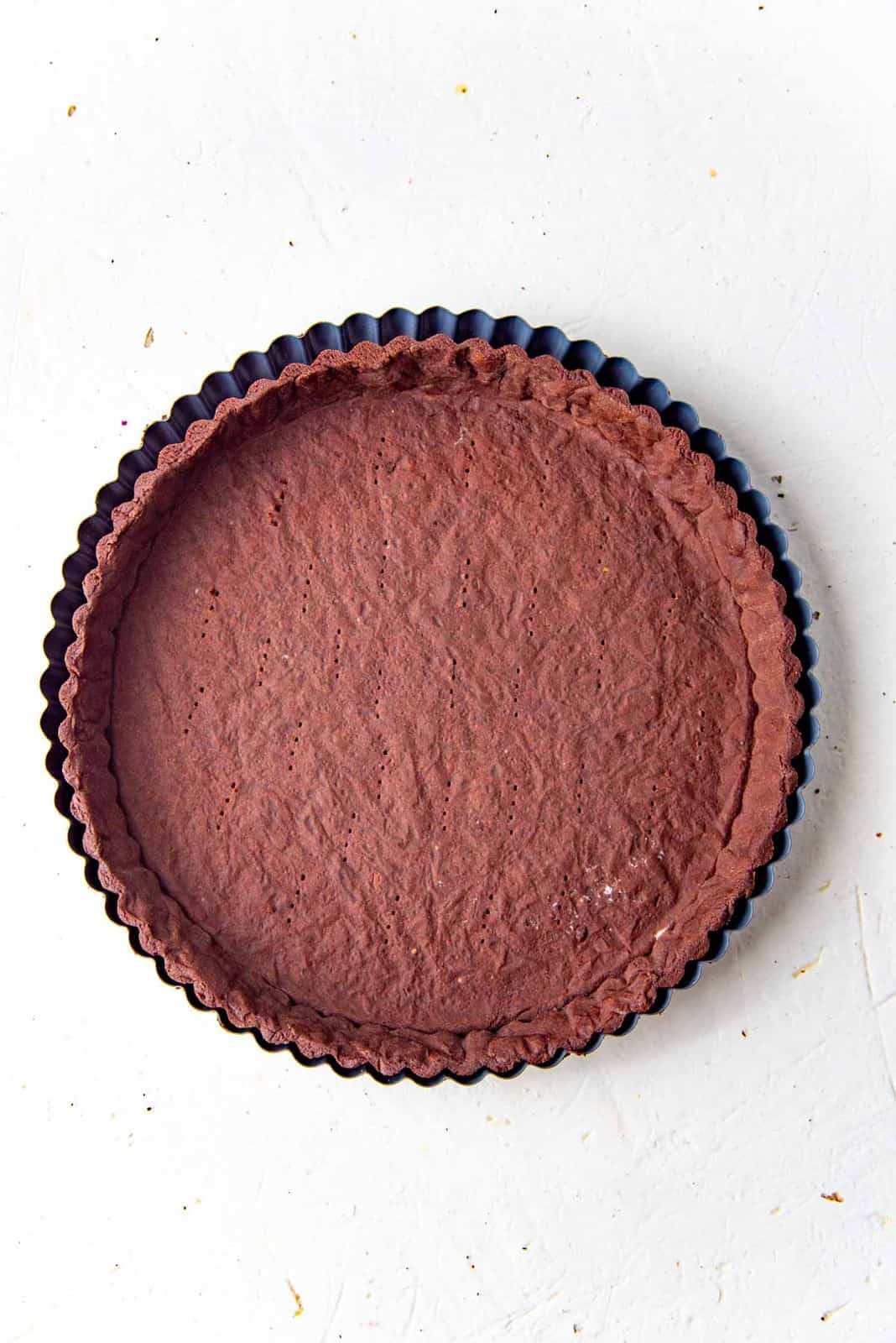 A freshly baked chocolate pate sucree tart shell