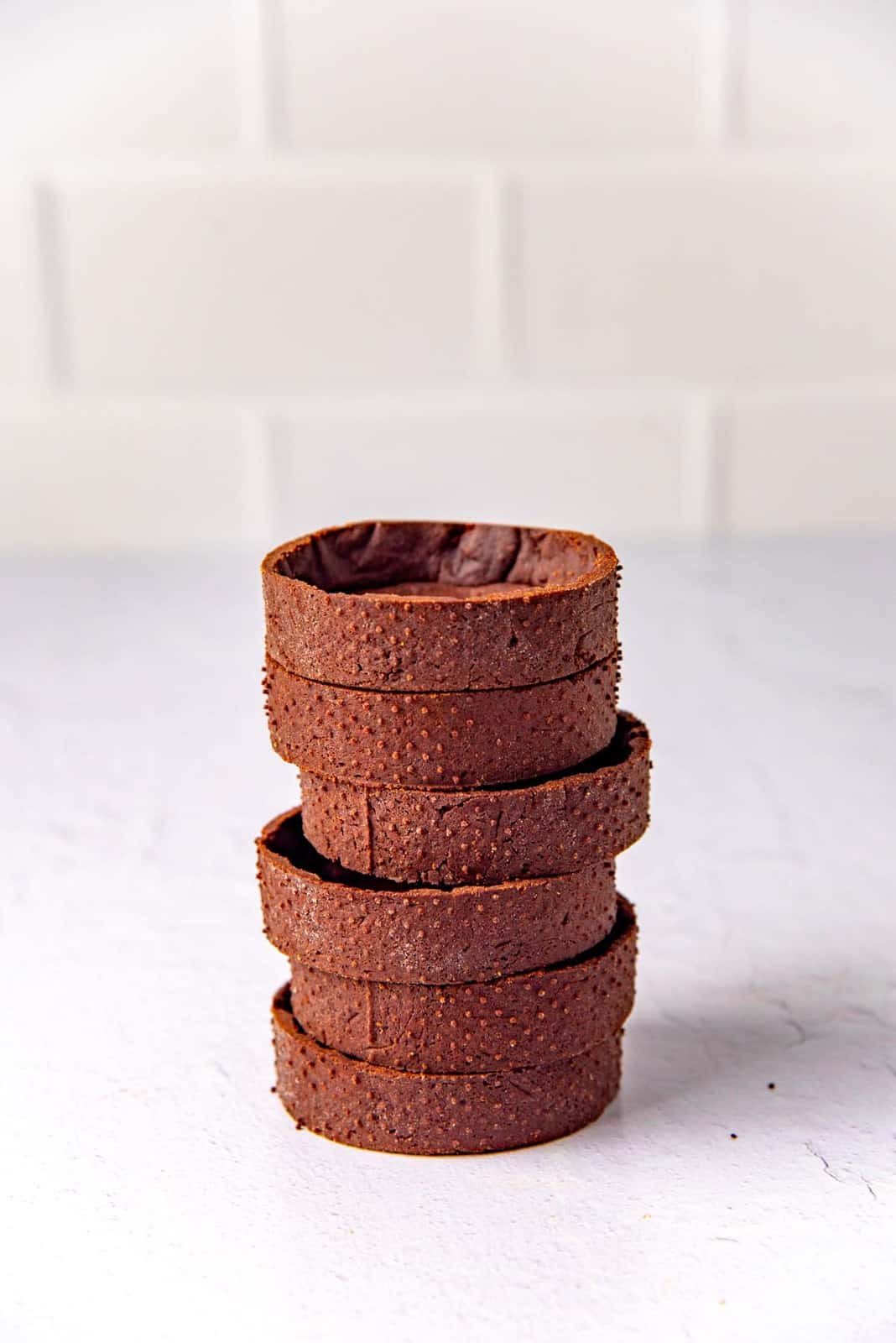 Mini Chocolate tarts stacked on top of each other