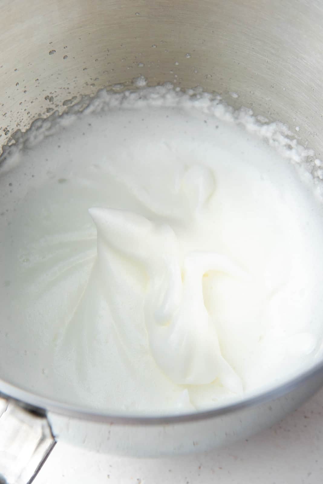 Pasteurized egg whites for the homemade eggnog recipe in a bowl.