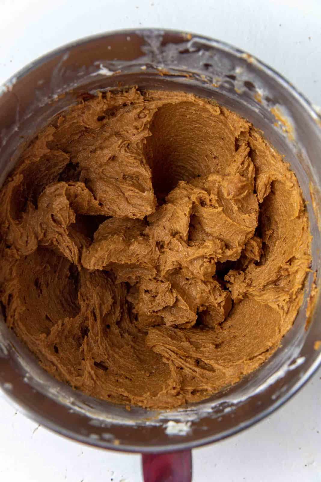 Creamed butter, sugar and molasses mix in a mixing bowl