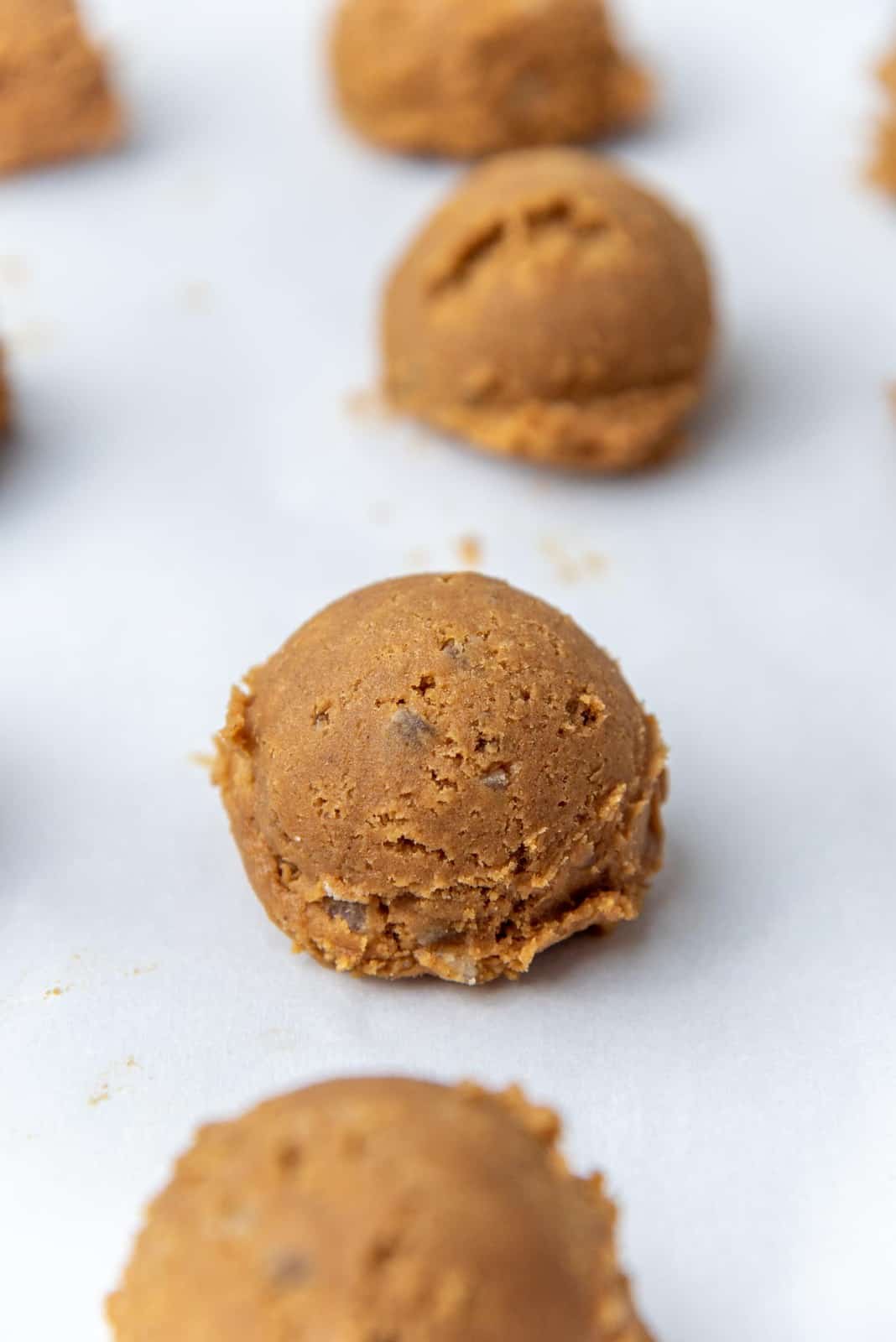 Portioned cookie dough on a baking sheet