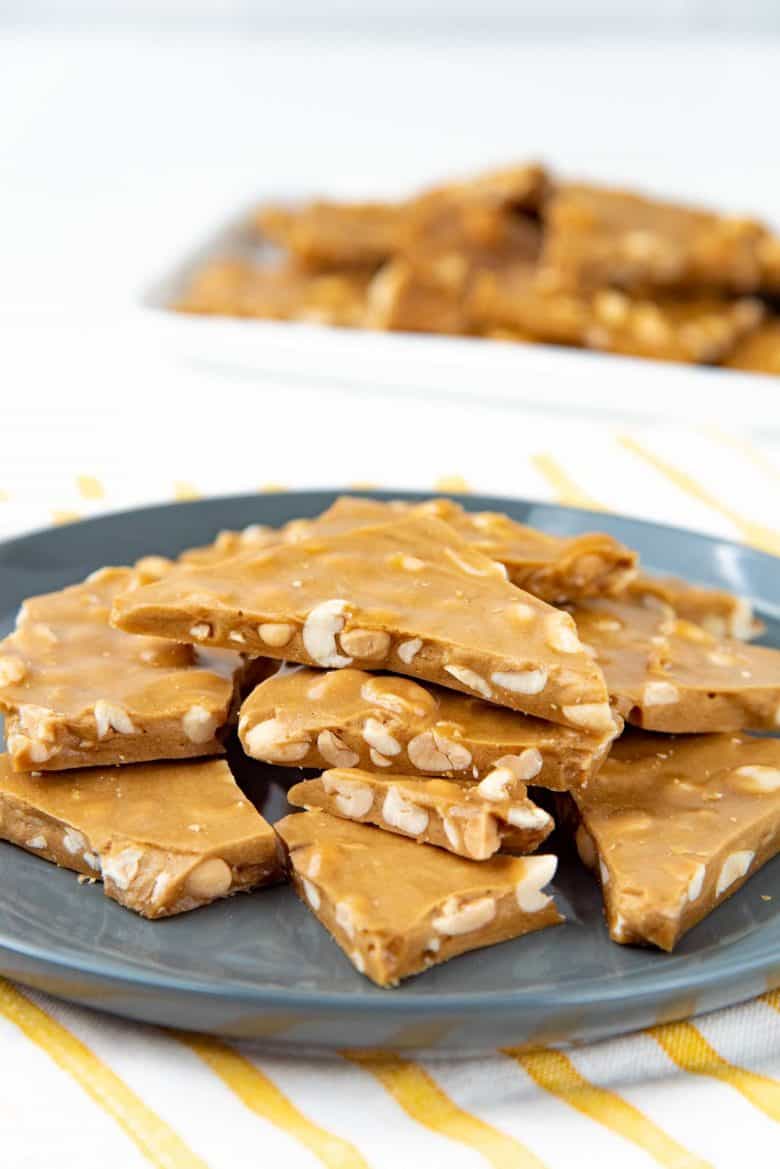 Peanut brittle served on a grey plate