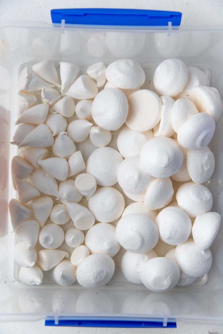 The meringue mushroom pieces after baking, in an air tight container