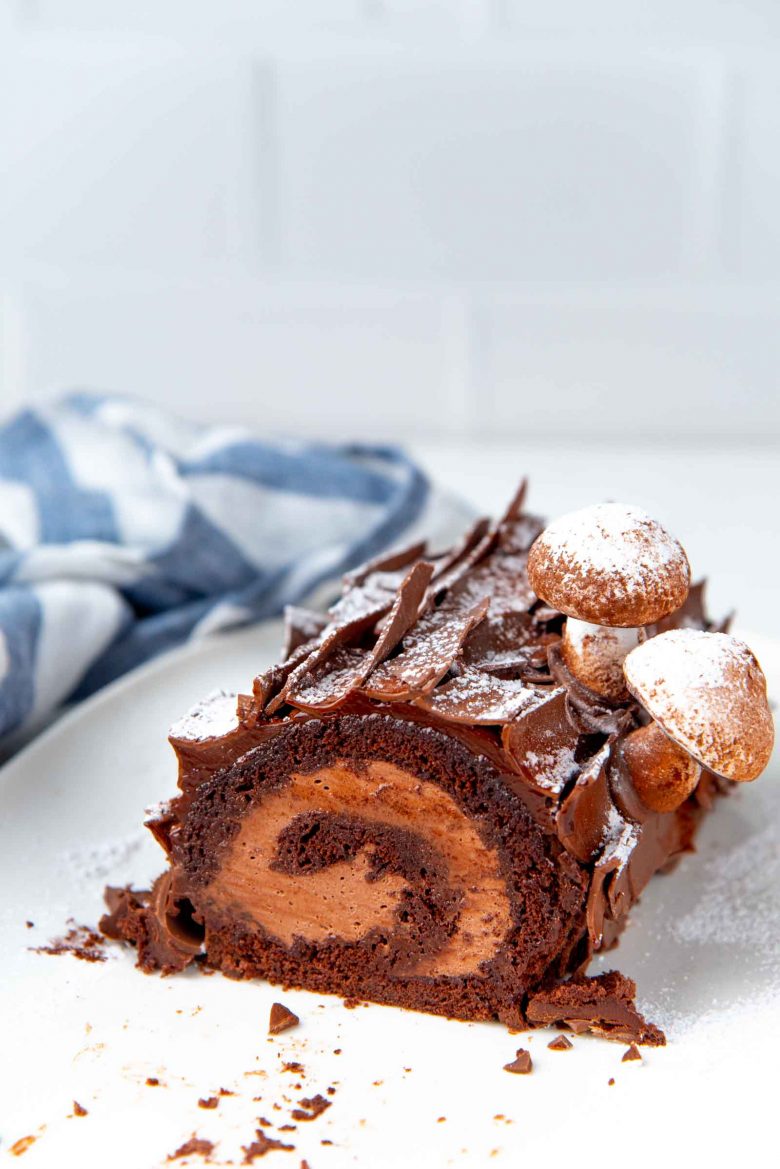 A cross section of the yule log cake with chocolate shards